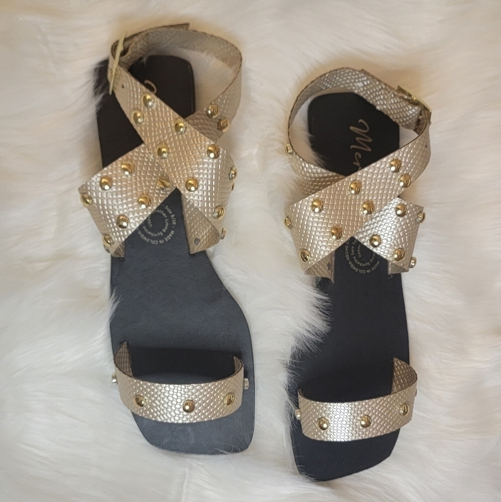 Gold colored sandal with studs, ankle straps